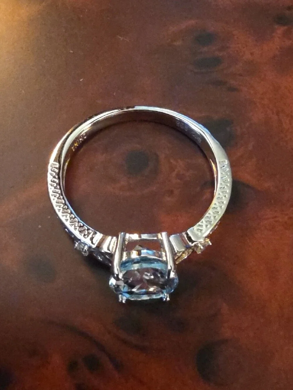 JTV Oval Glacier Topaz(TM) With White Topaz Rhodium Over Silver Ring